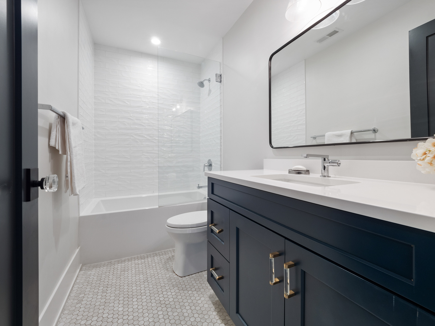 2252 North Orchard Street, Unit 3S Chicago, IL 60614 - Photo 26 of 31 a bathroom with a sink a toilet a mirror and shower