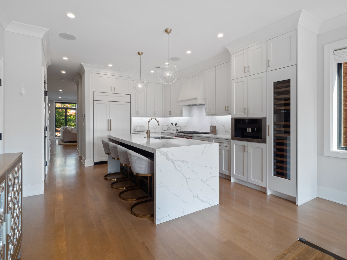 2252 North Orchard Street, Unit 3S Chicago, IL 60614 - Photo 8 of 31 a kitchen with a sink a refrigerator and chairs