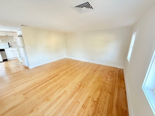 244 Main Street, Unit 2 North Andover, MA 01845 - Photo 16 of 36 a view of empty room with wooden floor