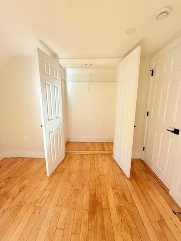 an empty room with wooden floor