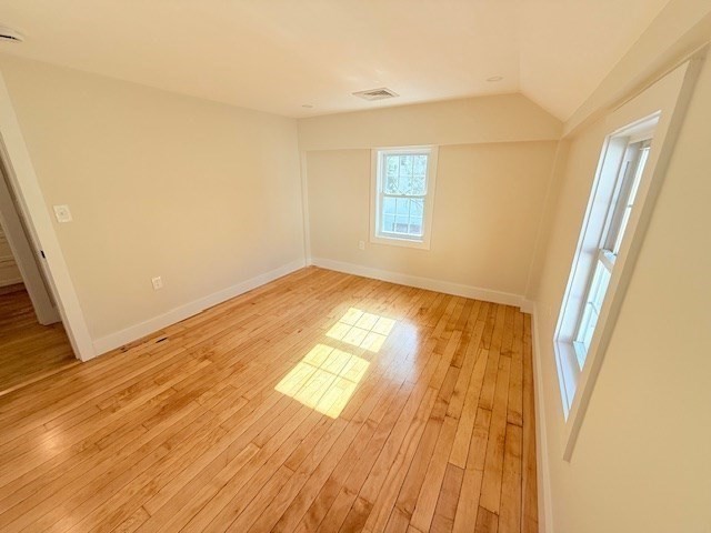 244 Main Street, Unit 2 North Andover, MA 01845 - Photo 25 of 36 a view of empty room with wooden floor and fan