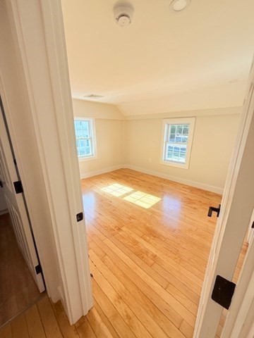 244 Main Street, Unit 2 North Andover, MA 01845 - Photo 26 of 36 a view of an empty room and wooden floor