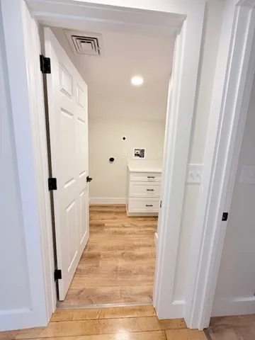 a bathroom with a sink toilet vanity and tub