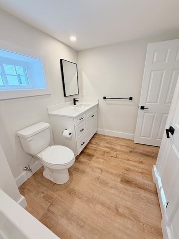 244 Main Street, Unit 2 North Andover, MA 01845 - Photo 30 of 36 a bathroom with a toilet sink and mirror