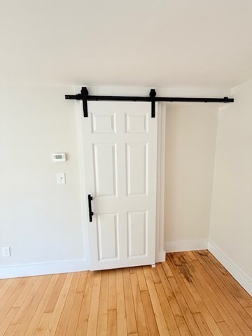 244 Main Street, Unit 2 North Andover, MA 01845 - Photo 5 of 36 a view of a room with wooden floor