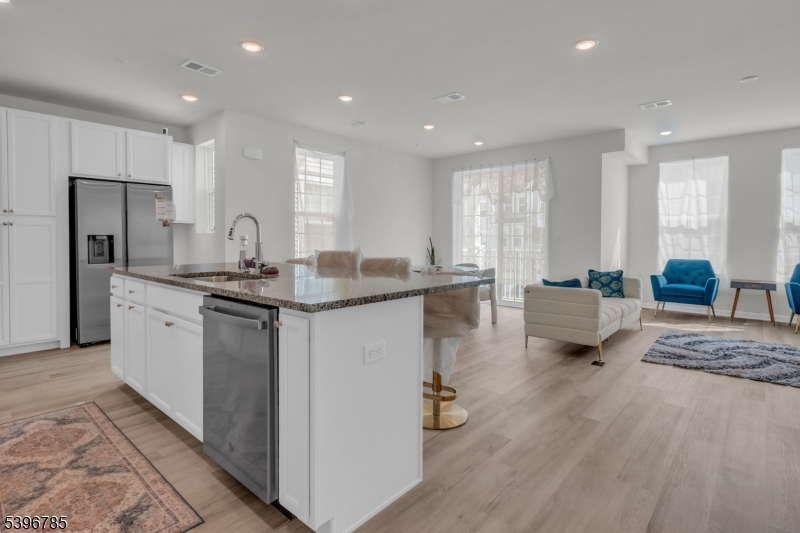 204 Honeysuckle Lane Warren, NJ 07059 - Photo 11 of 30 a kitchen with stainless steel appliances granite countertop a sink stove and refrigerator