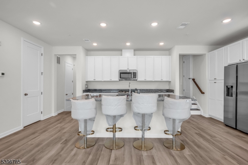 204 Honeysuckle Lane Warren, NJ 07059 - Photo 13 of 30 a large kitchen with a table and chairs