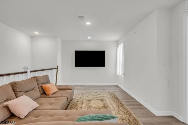 a living room with a couch and a flat screen tv