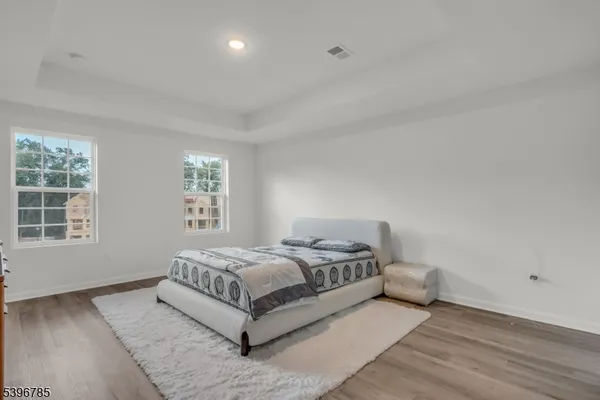 a living room with a bed furniture and a window