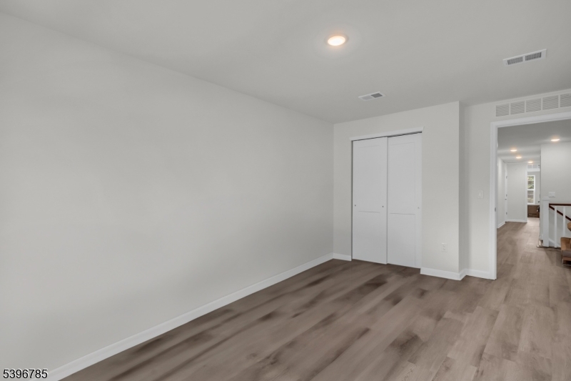 204 Honeysuckle Lane Warren, NJ 07059 - Photo 25 of 30 a view of a room with wooden floor