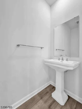 a bathroom with a sink and mirror