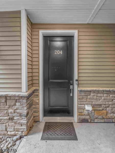 204 Honeysuckle Lane Warren, NJ 07059 - Photo 4 of 30 a view of front door and a window