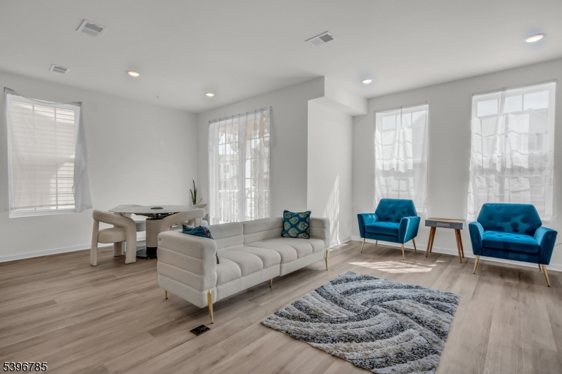 204 Honeysuckle Lane Warren, NJ 07059 - Photo 7 of 30 a living room with furniture and wooden floor