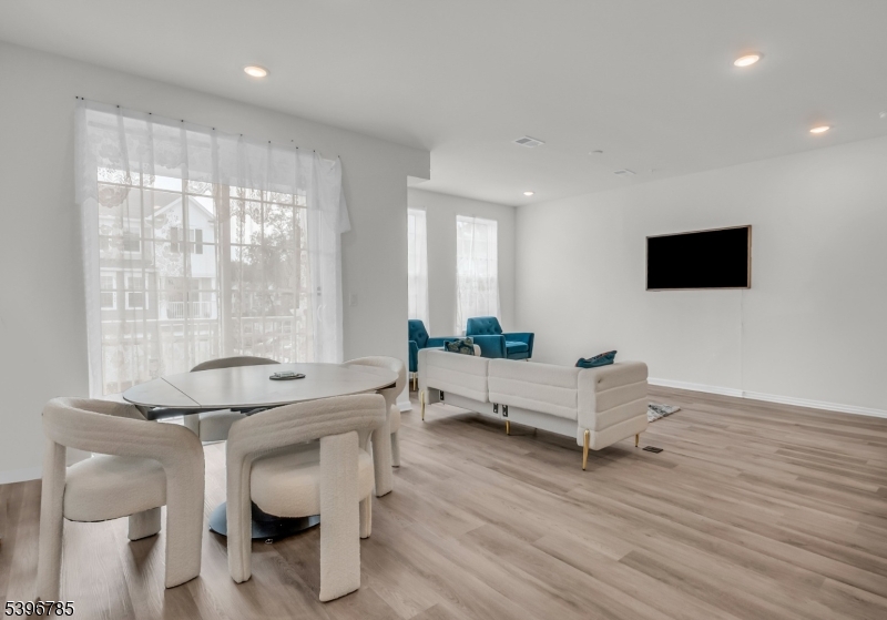 204 Honeysuckle Lane Warren, NJ 07059 - Photo 9 of 30 a living room with furniture and a flat screen tv