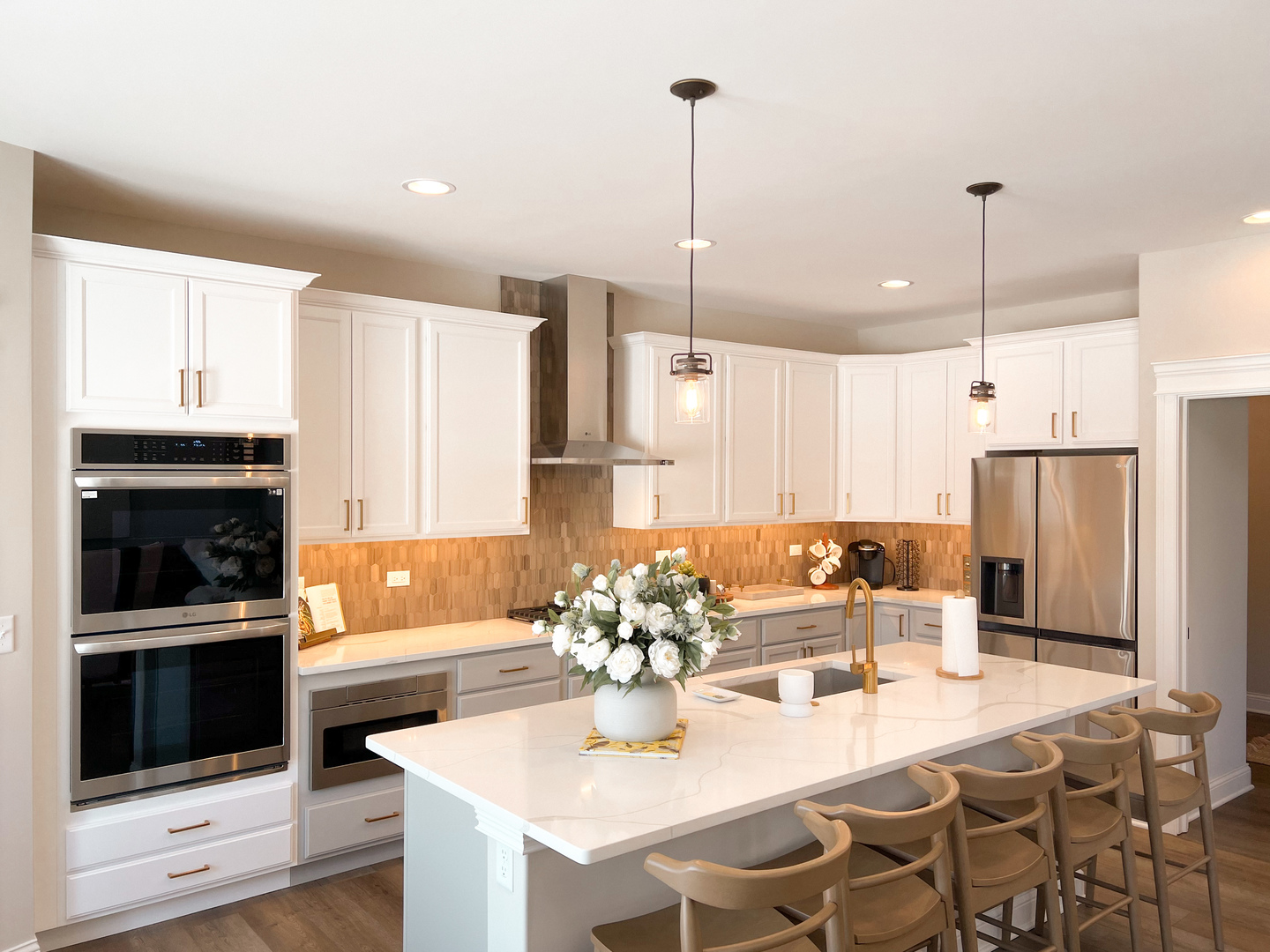 4S830 Deerpath Road Aurora, IL 60506 - Photo 11 of 25 a kitchen with stainless steel appliances kitchen island granite countertop a refrigerator a stove a microwave oven a sink with a dining table and chairs