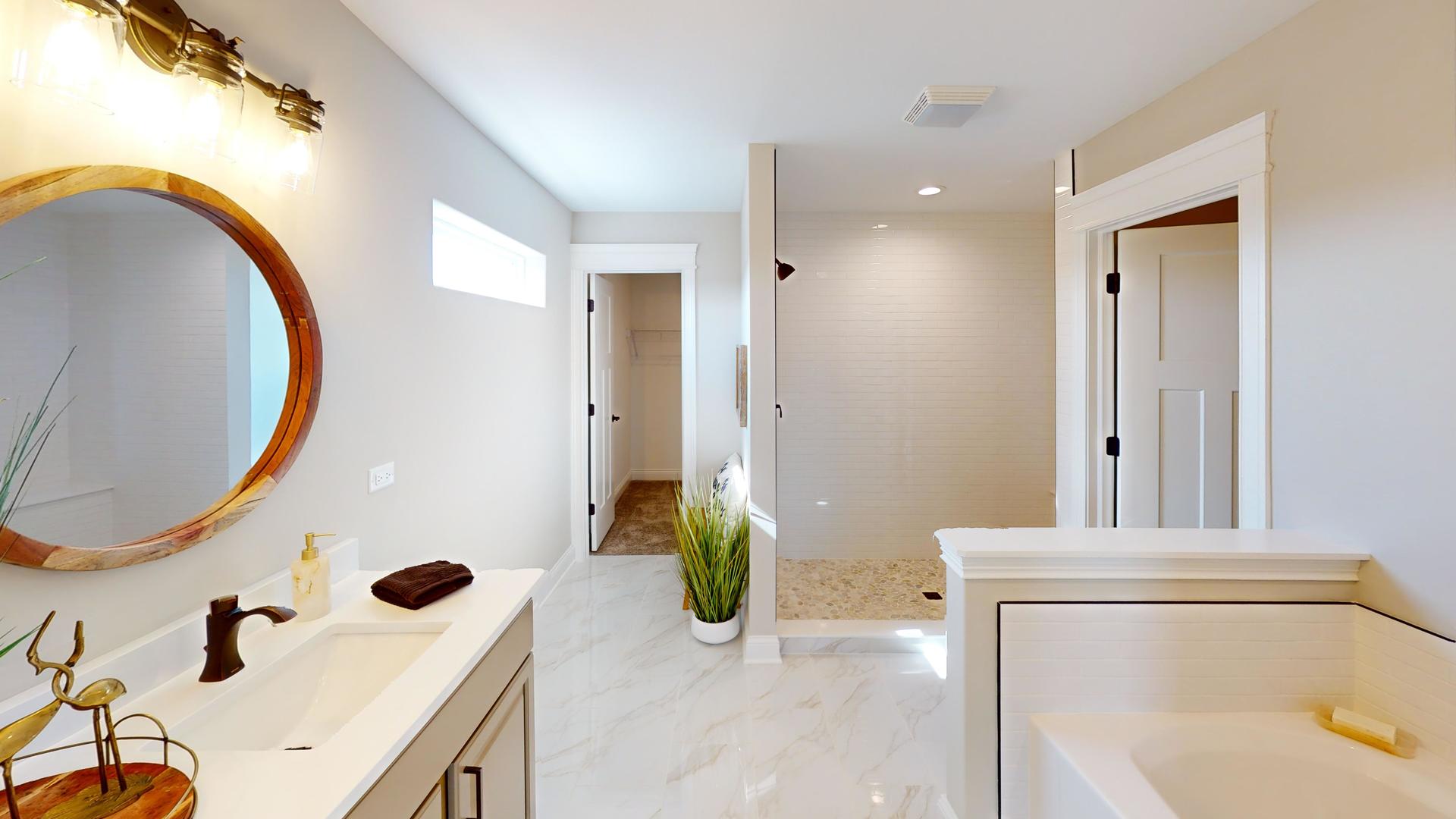4S830 Deerpath Road Aurora, IL 60506 - Photo 12 of 25 a bathroom with a tub sink and mirror