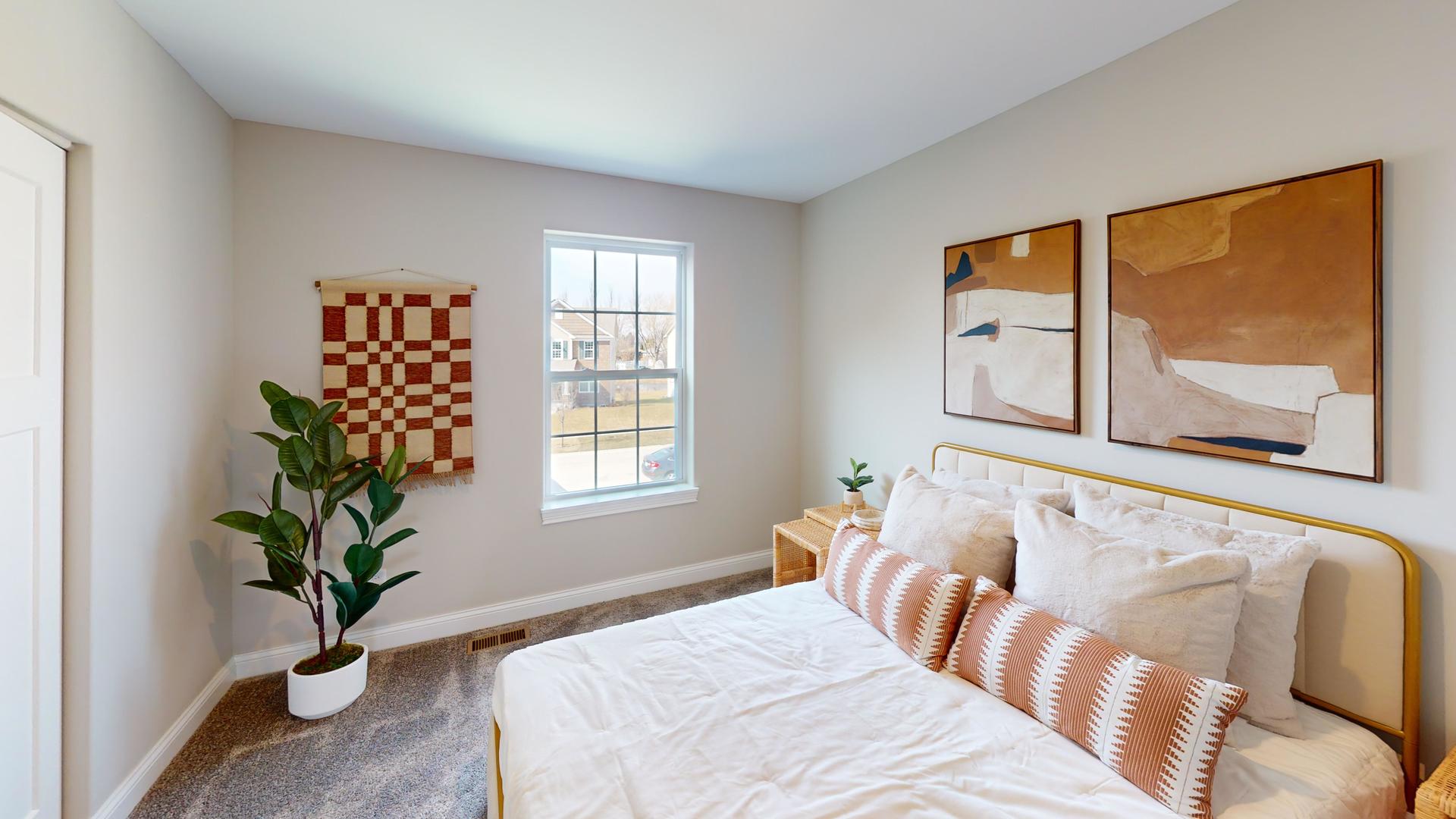 4S830 Deerpath Road Aurora, IL 60506 - Photo 21 of 25 a bedroom with a large bed and a potted plant