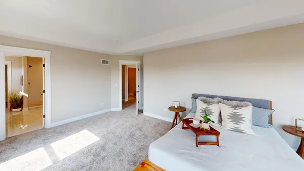 a view of a room with workspace and bedroom