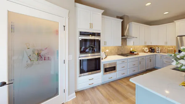 a kitchen with stainless steel appliances a refrigerator sink and cabinets