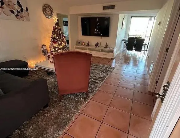 a living room with a couch and a flat screen tv