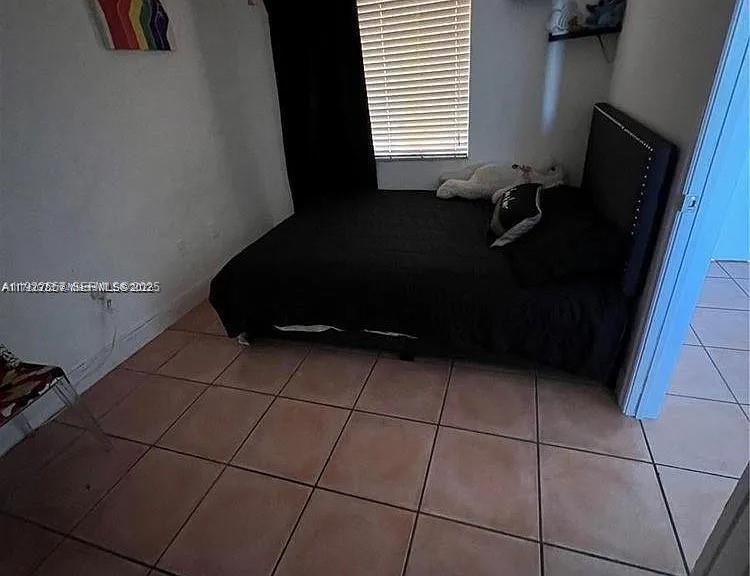 8600 Southwest 133rd Avenue Road, Unit 423 Miami, FL 33183 - Photo 13 of 17 a room with a black white checkered floor