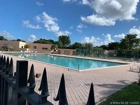 a view of swimming pool with a yard