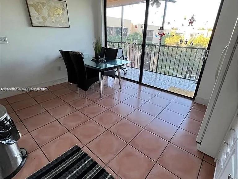 8600 Southwest 133rd Avenue Road, Unit 423 Miami, FL 33183 - Photo 7 of 17 a view of a workspace with furniture and a gate