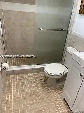 8600 Southwest 133rd Avenue Road, Unit 423 Miami, FL 33183 - Photo 9 of 17 a bathroom with a toilet and a shower
