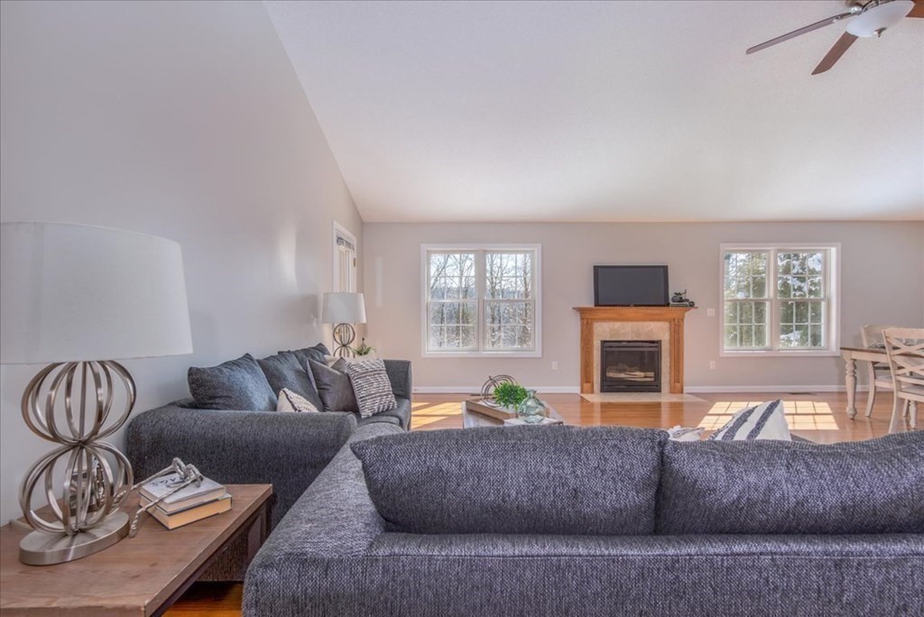 46 Palmer Road, Unit 12 Monson, MA 01057 - Photo 4 of 26 a living room with furniture and a fireplace