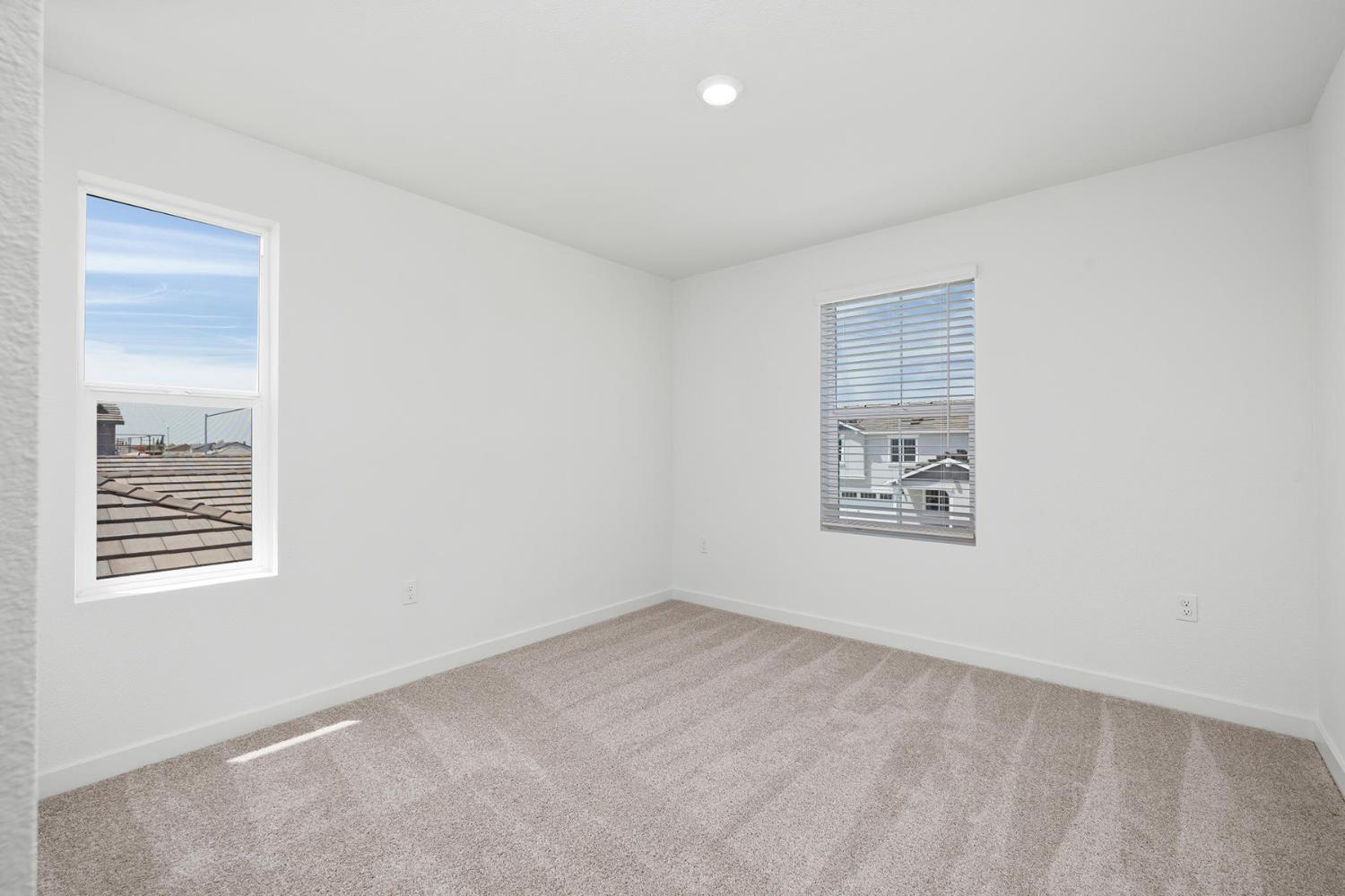 820 Helmsley Lane Patterson, CA 95363 - Photo 14 of 18 an empty room with windows