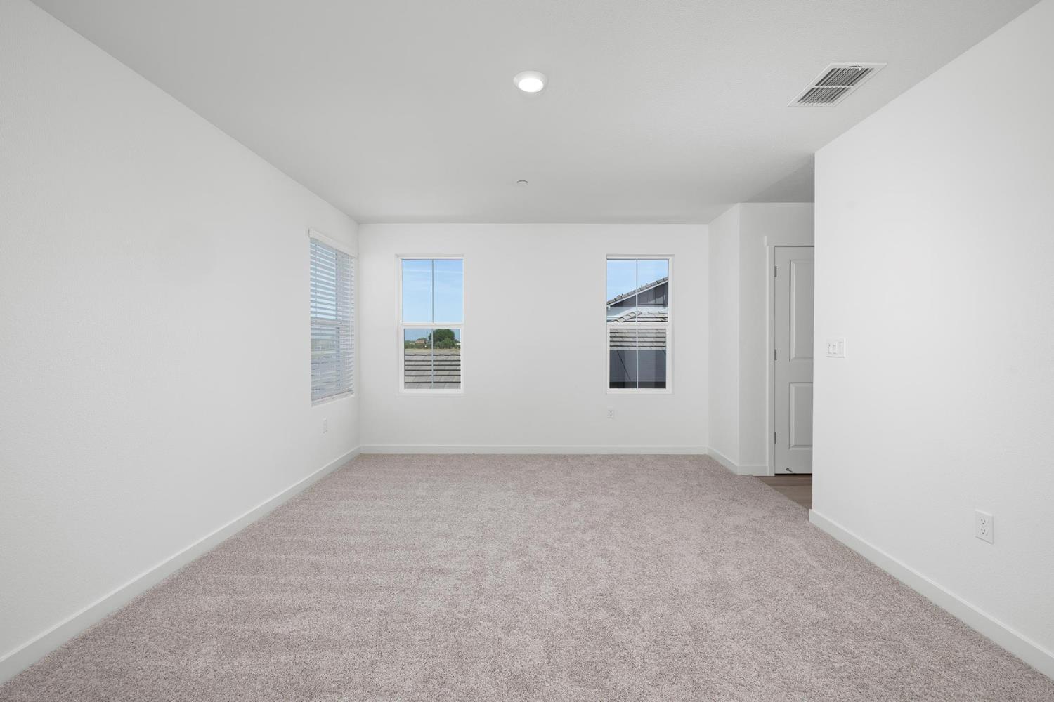 820 Helmsley Lane Patterson, CA 95363 - Photo 8 of 18 an empty room with windows