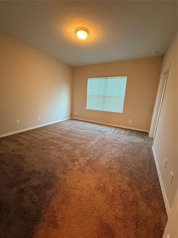 7843 Hardenton Street Windermere, FL 34786 - Photo 15 of 19 an empty room with a window