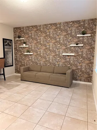a living room with furniture and a rug