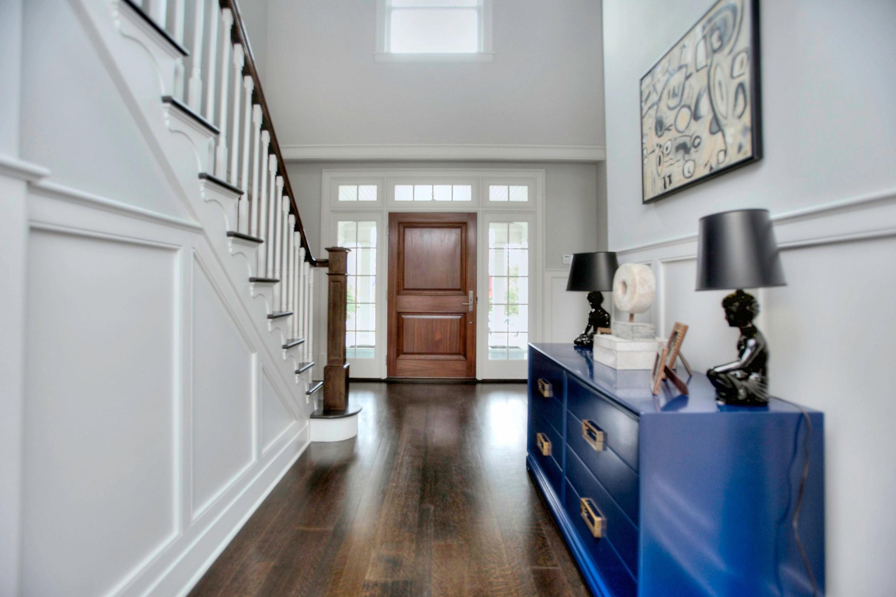 24 Cross Road Darien, CT 06820 - Photo 11 of 53 a view of a hallway with furniture and stairs