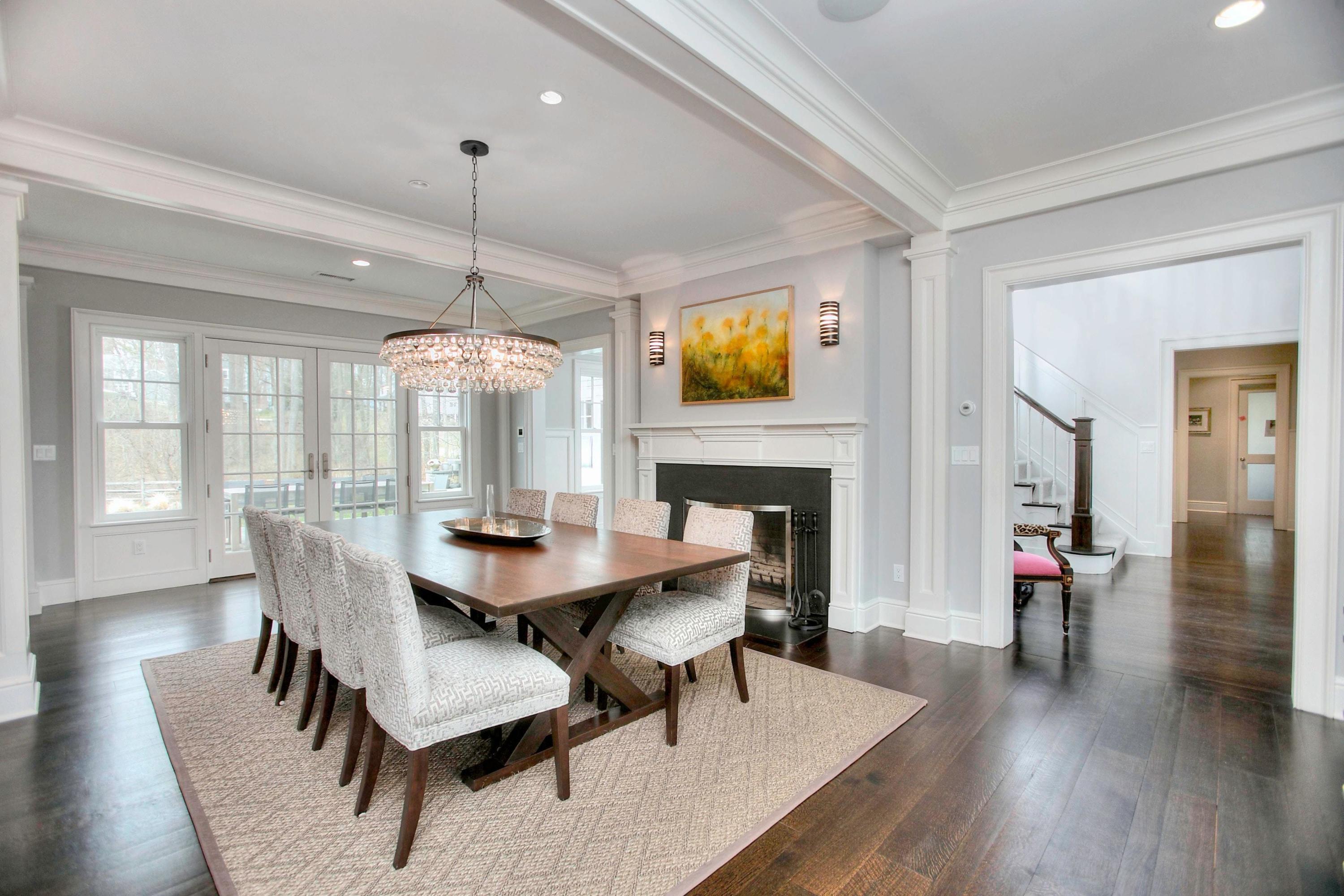 24 Cross Road Darien, CT 06820 - Photo 13 of 53 a dining room with furniture a chandelier and wooden floor