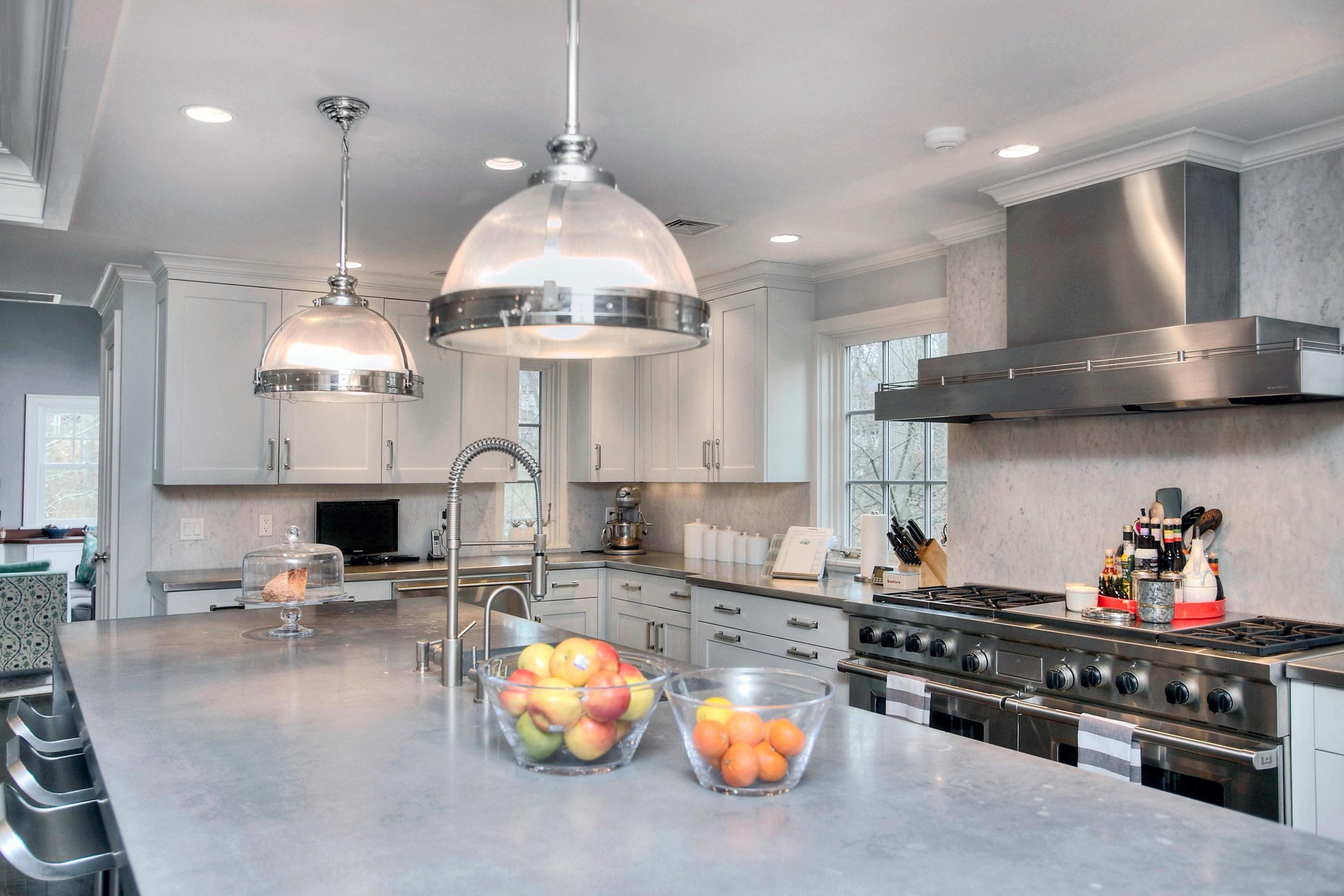 24 Cross Road Darien, CT 06820 - Photo 24 of 53 a kitchen with stainless steel appliances granite countertop a stove a sink a refrigerator and chairs