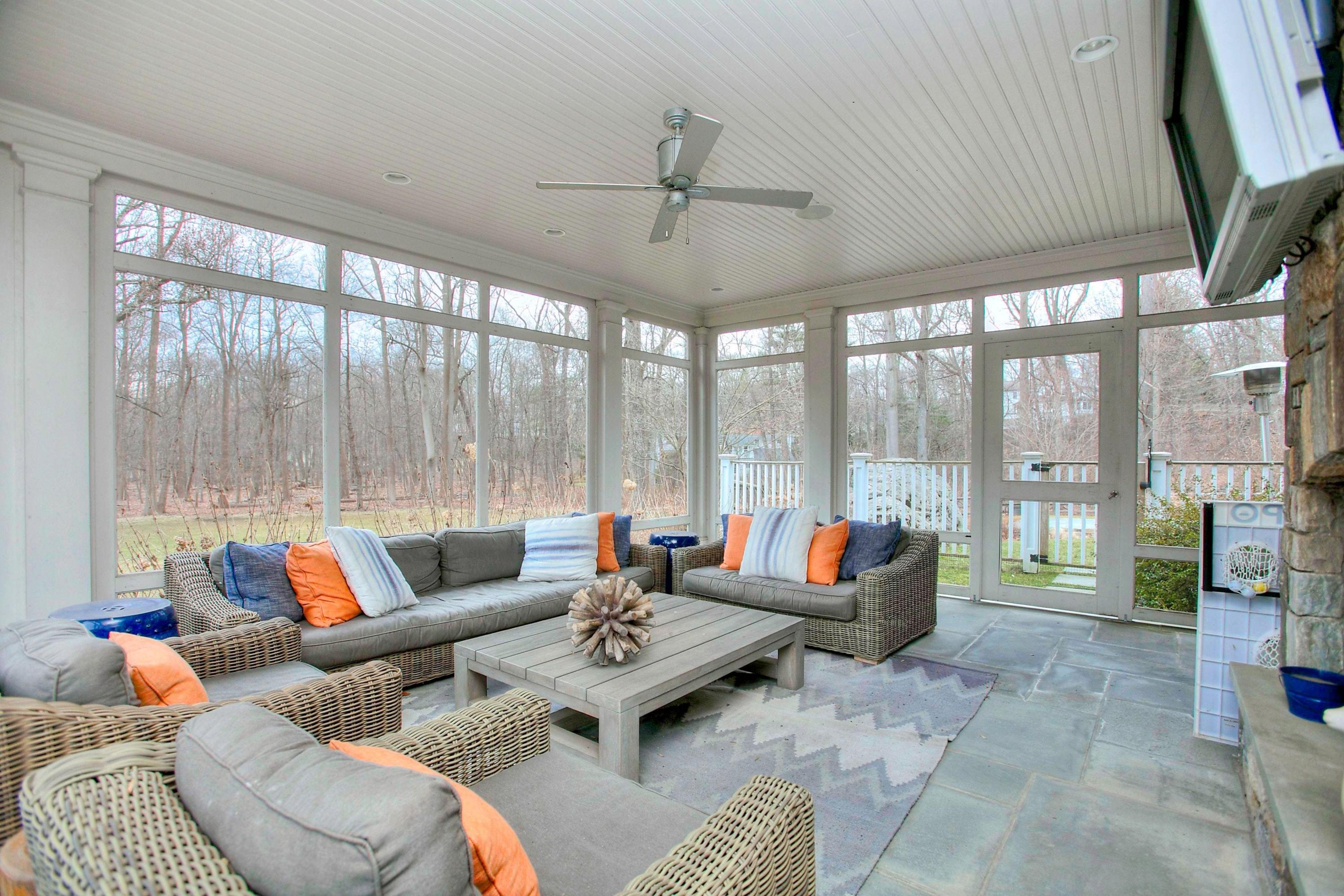 24 Cross Road Darien, CT 06820 - Photo 27 of 53 a living room with furniture and large windows