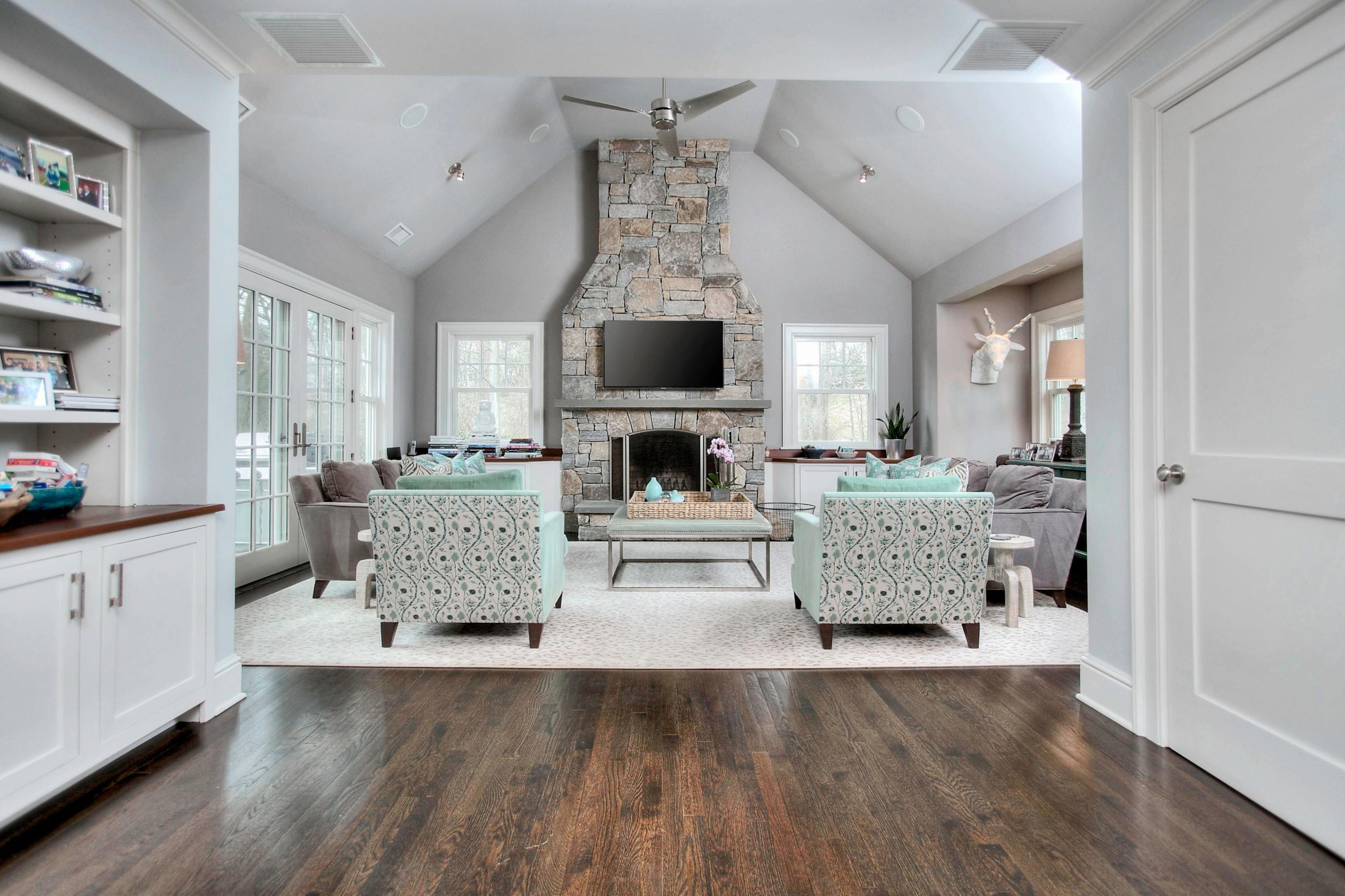 24 Cross Road Darien, CT 06820 - Photo 28 of 53 a living room with furniture and a fireplace