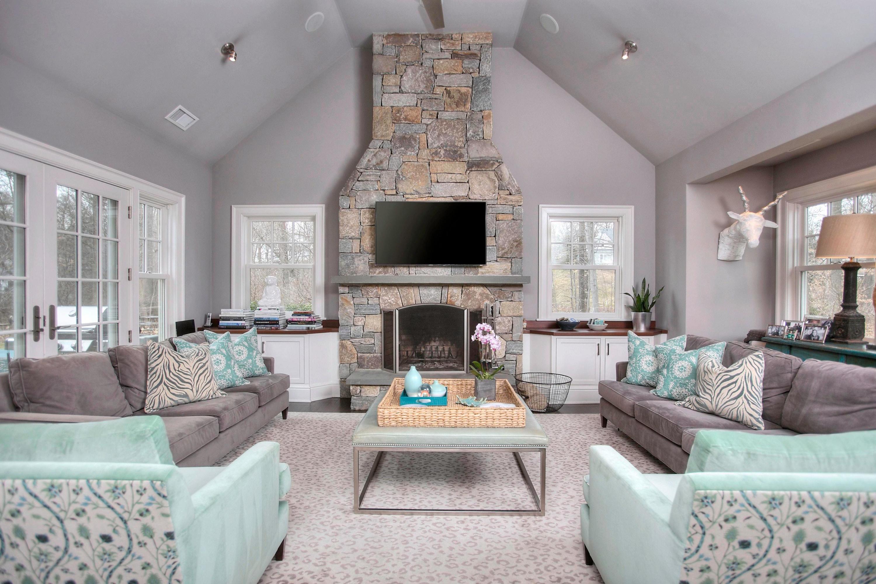 24 Cross Road Darien, CT 06820 - Photo 29 of 53 a living room with furniture fireplace and window