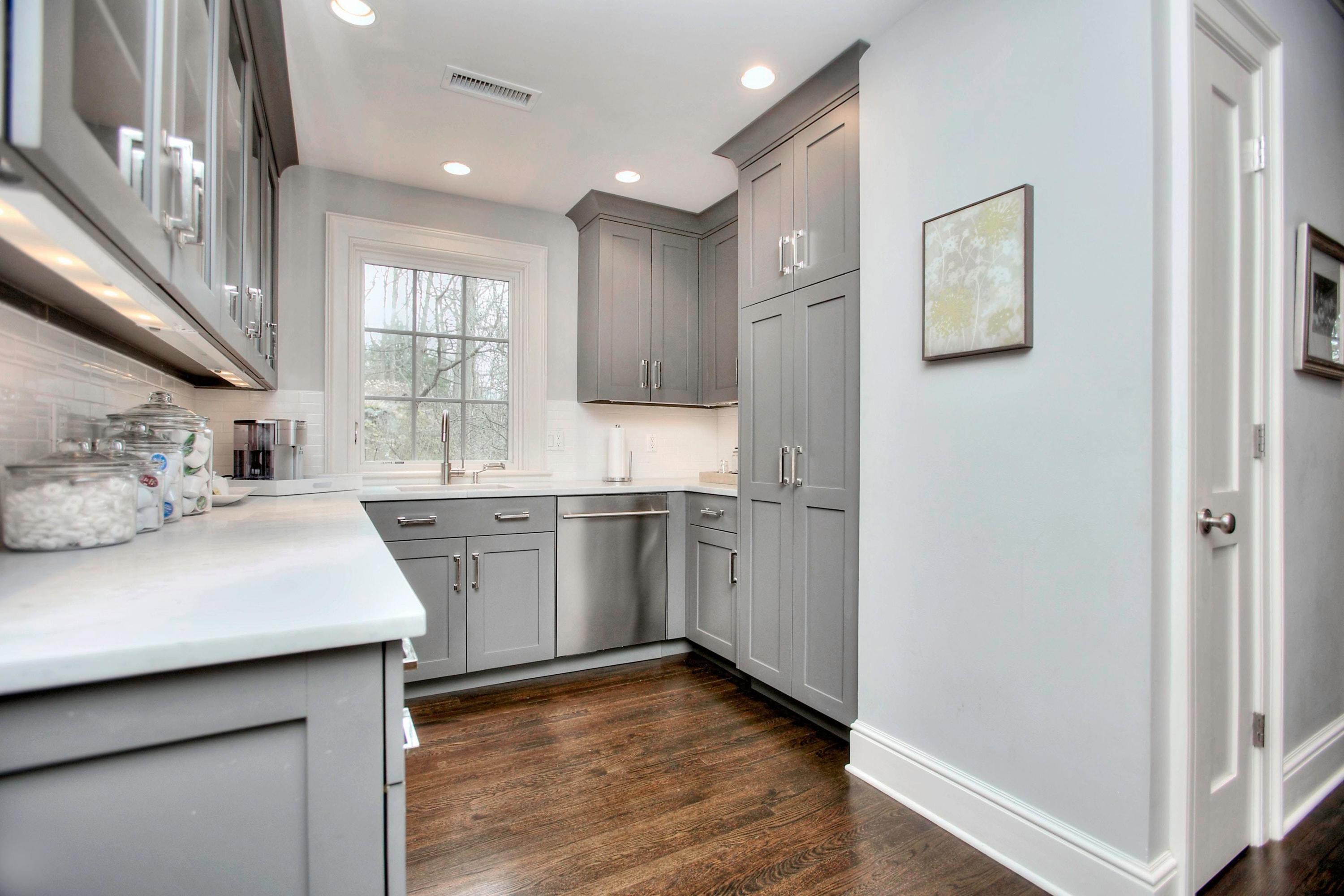 24 Cross Road Darien, CT 06820 - Photo 31 of 53 a kitchen with a sink cabinets and wooden floor