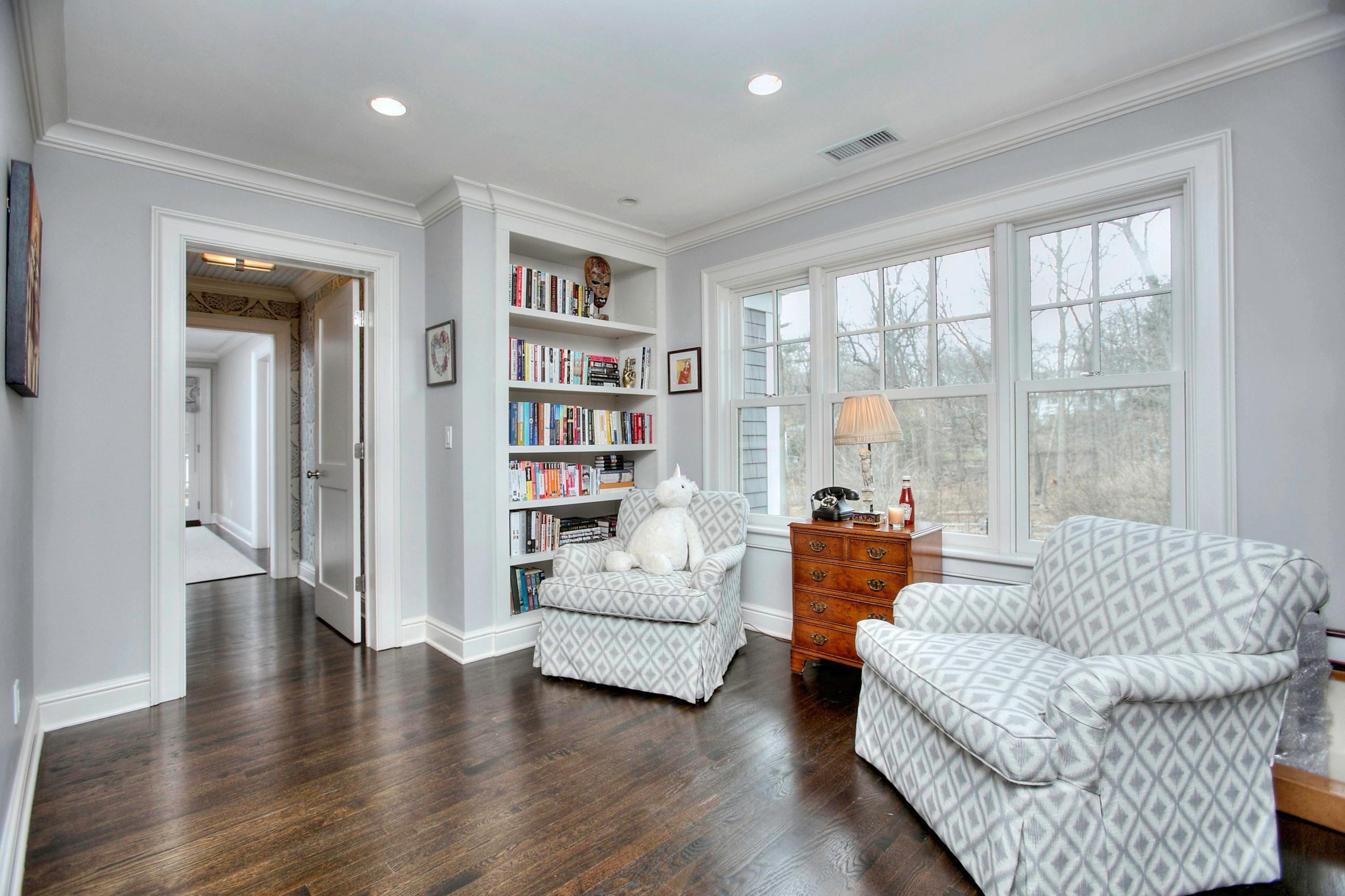 24 Cross Road Darien, CT 06820 - Photo 35 of 53 a living room with furniture and a large window