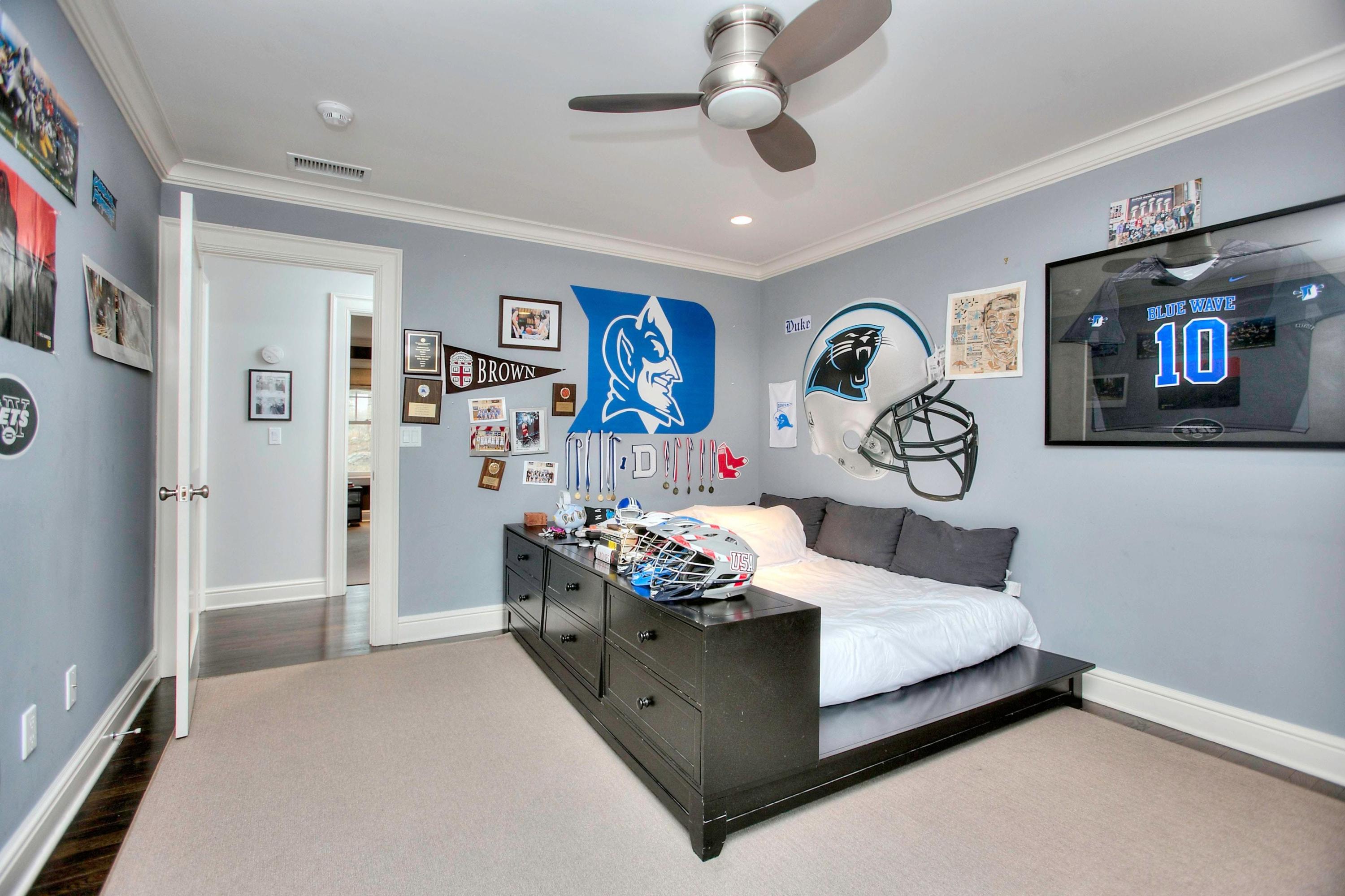 24 Cross Road Darien, CT 06820 - Photo 42 of 53 a bedroom with a bed and a tv