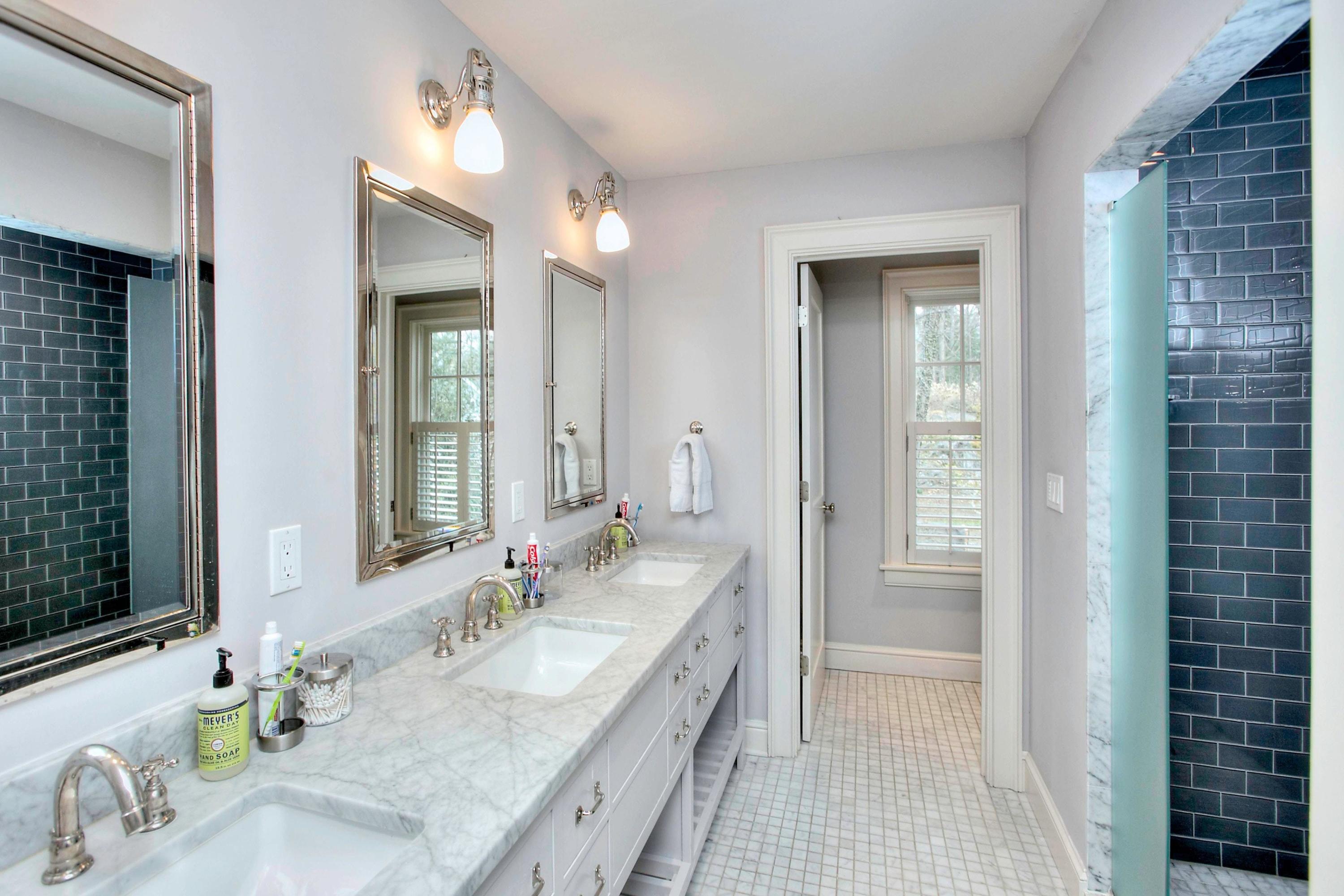 24 Cross Road Darien, CT 06820 - Photo 44 of 53 a bathroom with a granite countertop sink and a mirror