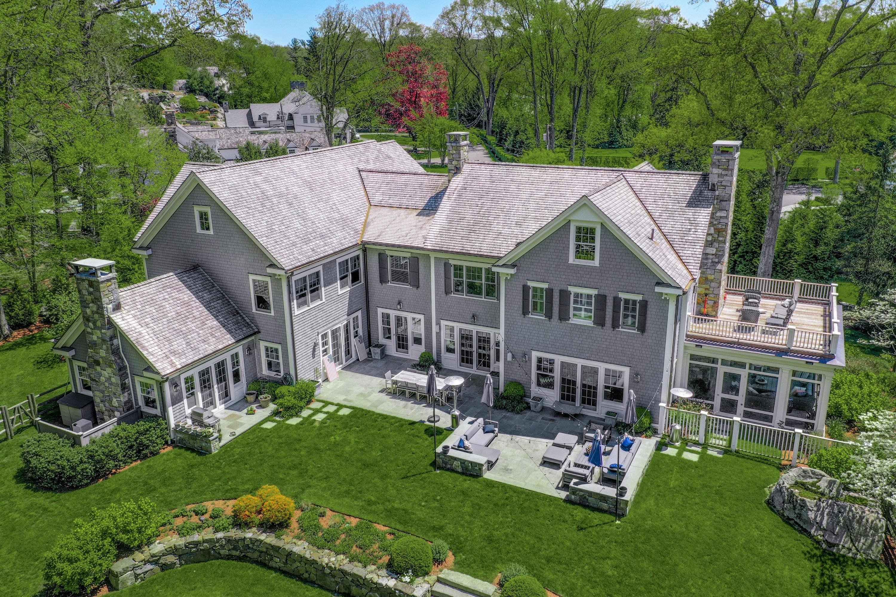 24 Cross Road Darien, CT 06820 - Photo 7 of 53 a aerial view of a house with a yard table and chairs