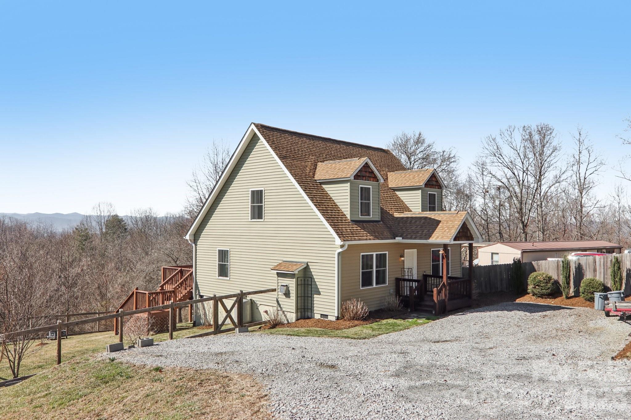 751 Hutch Mountain Road Fletcher, NC 28732 - Photo 4 of 48 a view of a house with backyard