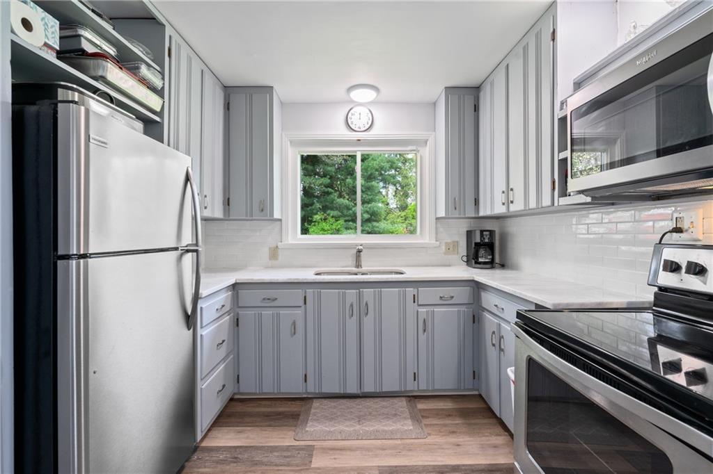 594 Whitestown Road Butler, PA 16001 - Photo 12 of 25 a kitchen with a refrigerator stove and microwave