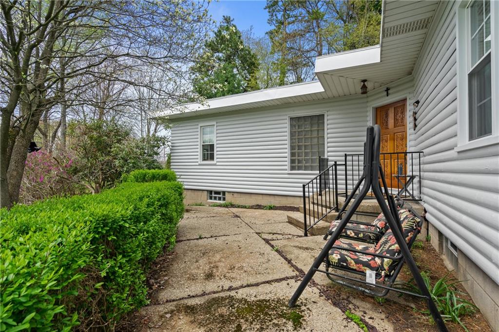 594 Whitestown Road Butler, PA 16001 - Photo 15 of 25 a view of a house with backyard and trees