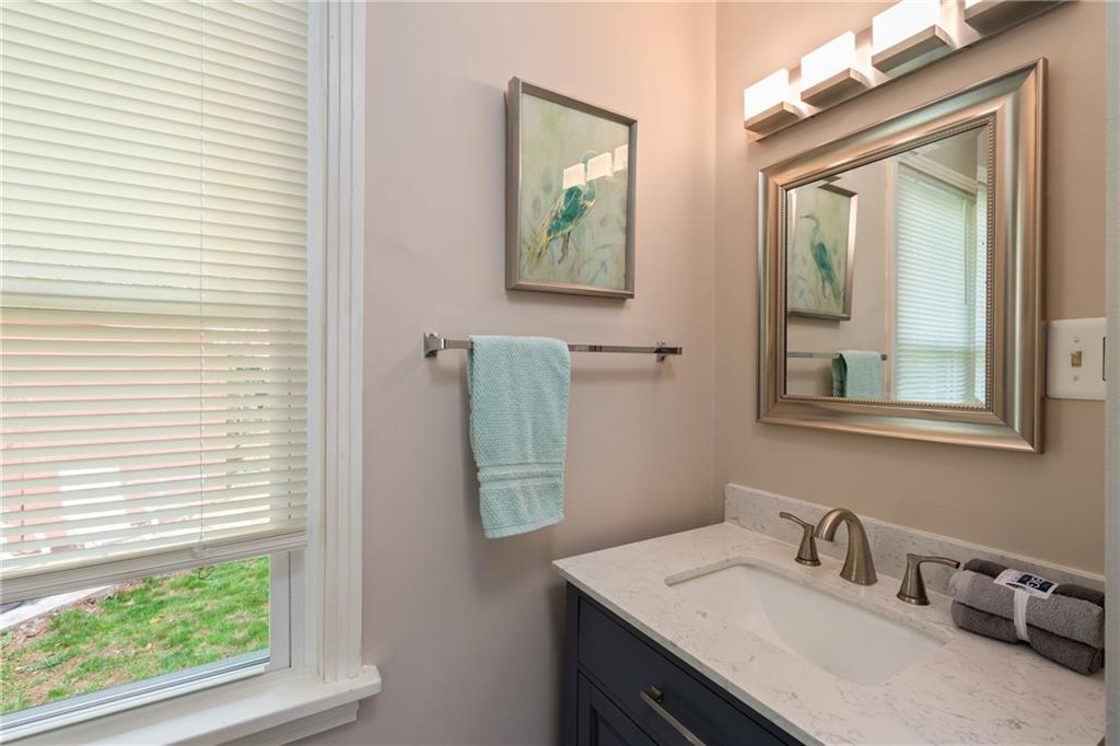 594 Whitestown Road Butler, PA 16001 - Photo 18 of 25 a bathroom with a granite countertop sink and a mirror