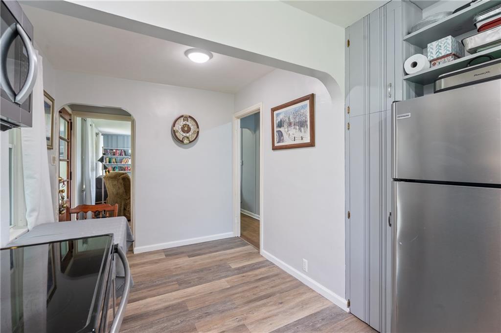 594 Whitestown Road Butler, PA 16001 - Photo 22 of 25 a view of a storage & utility room with a refrigerator