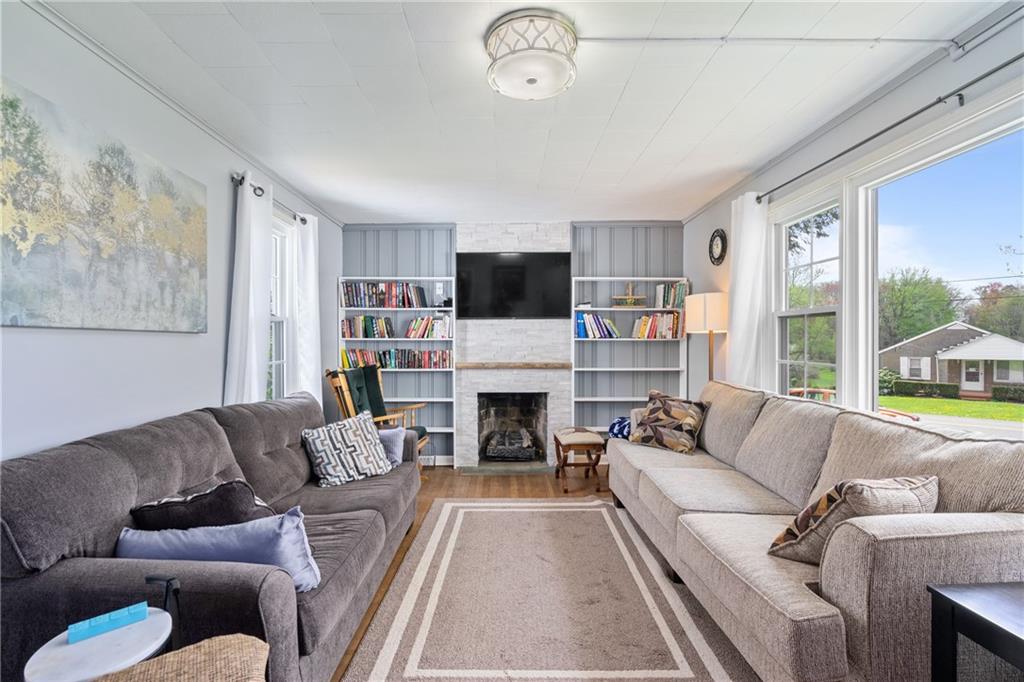594 Whitestown Road Butler, PA 16001 - Photo 25 of 25 a living room with fireplace furniture and a flat screen tv